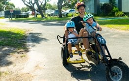 eastern beach pedal go kart man with children