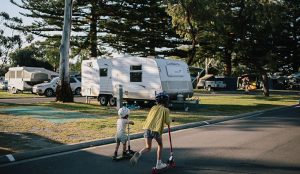 Two kids playing in the caravan park area