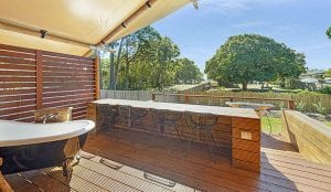 Outdoor bath and seating in a glamping safari tent