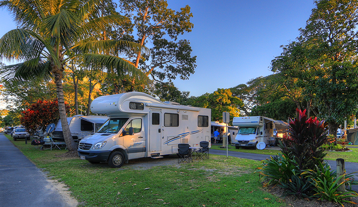 Caravan park in Cairns with motorhomes parked on sites surrounded by trees