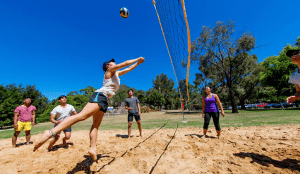 Group of people plays volley ball in Halls Gap