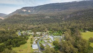 brids eye view of a halls gap caravan park and mountains in the background