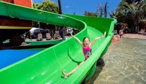 Young girl on a slide at the water park