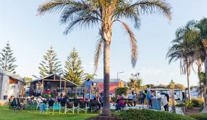 A group of people socialising inside a Shellharbour holiday park