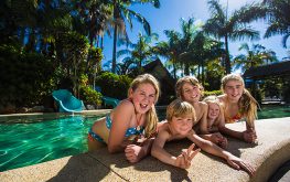 five happy kids swimming in Coffs Harbour