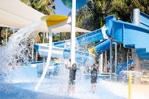 Two kids playing at the new waterpark